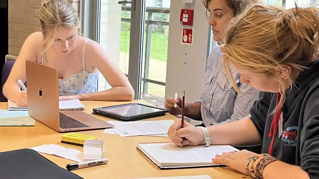 Arij teaching students during a STEP mathematics workshop